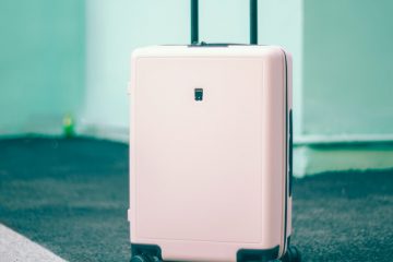 white and black luggage
